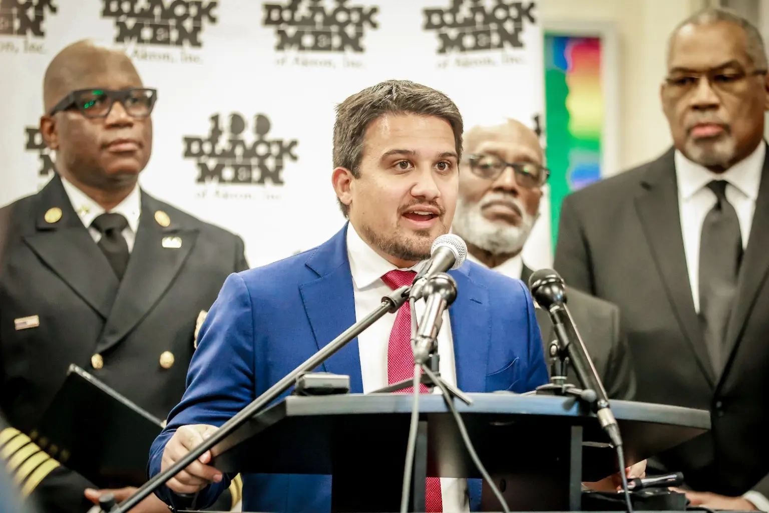 A community representative speaking at a 100 Black Men of Akron press conference