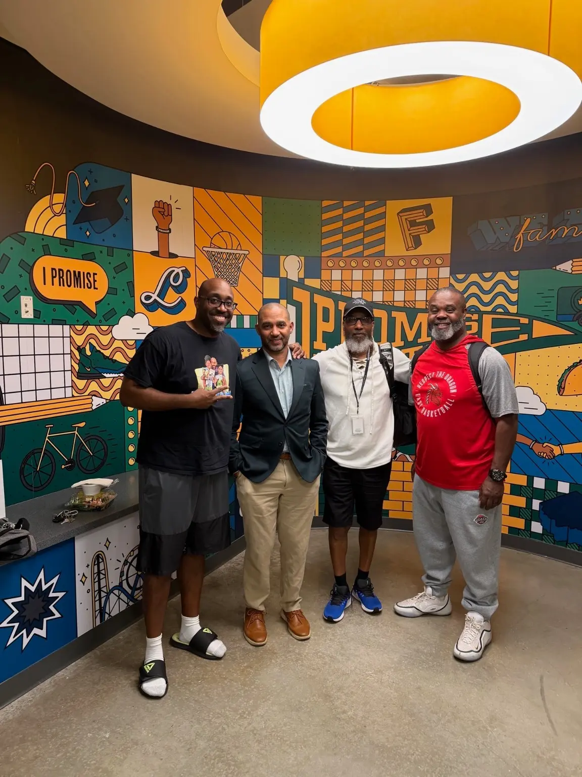 100 Black Men of Akron members connecting during a community visit
