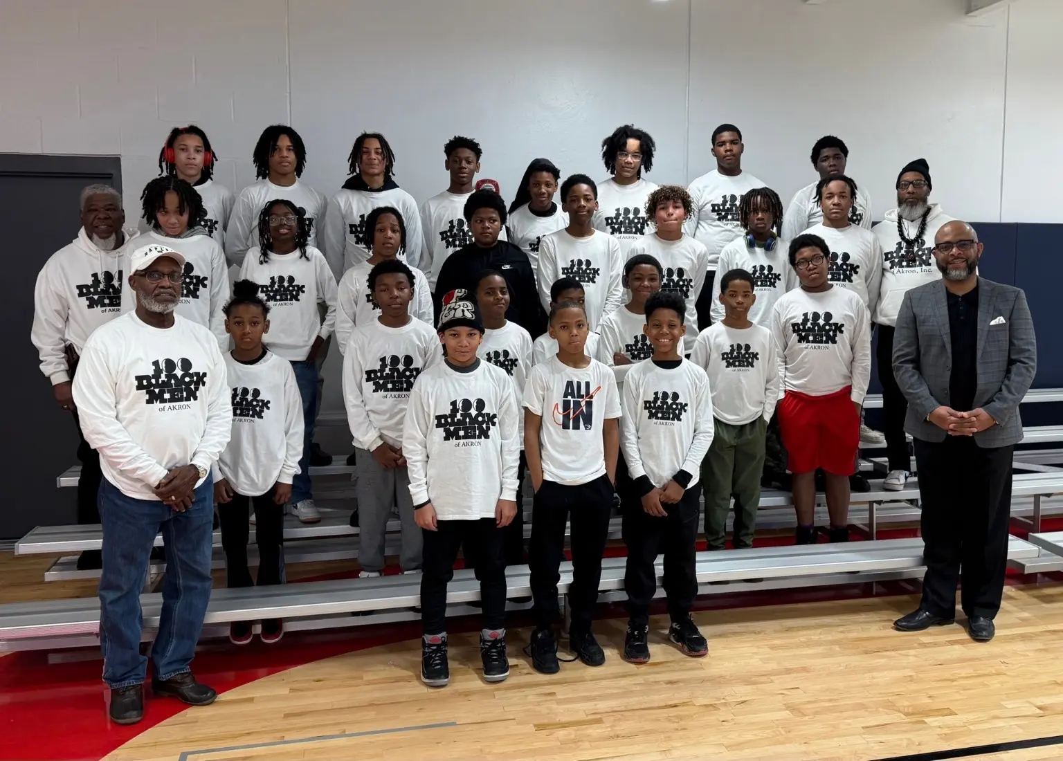Leadership Academy participants and mentors gathered in a school gym